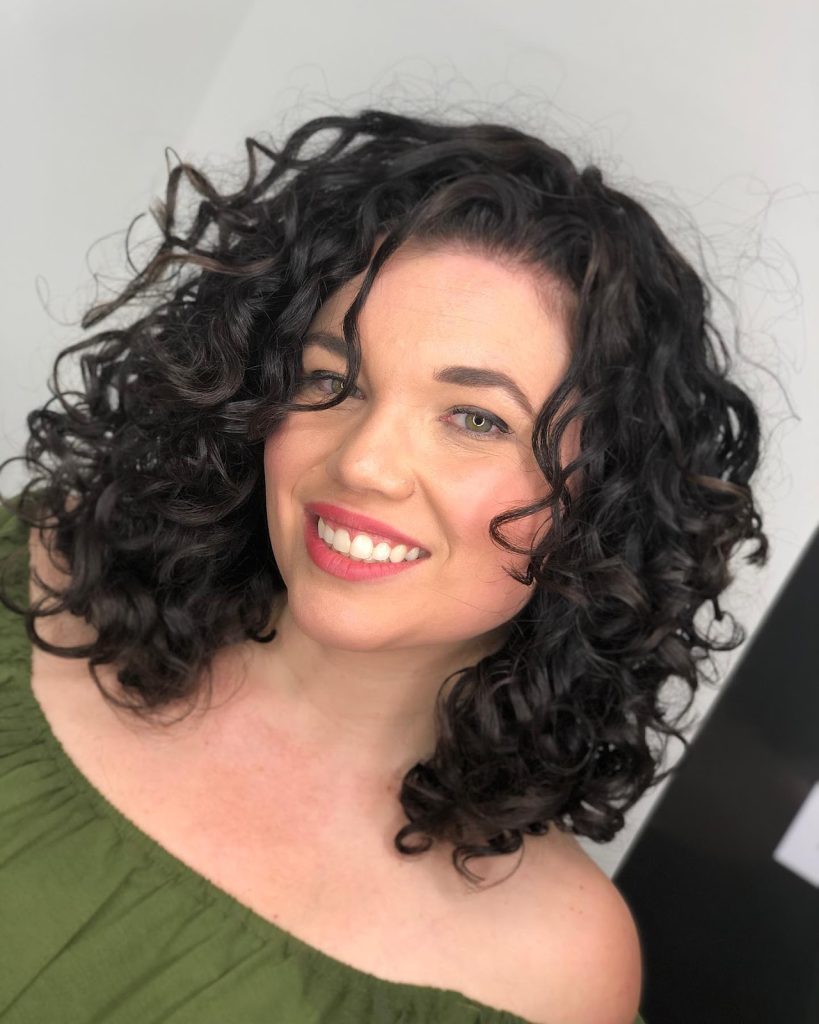 Learn how Curls Gone Wild Salon, Gilbert's top rated curly hair salon, helps clients recover their natural curl pattern from hair straightening damage. Excessive heat damage has stunted curl recovery and your natural beauty. Come learn how you can reignite your love for your curly hair! Gilbert hair salon for curly hair, curly hair salon in Gilbert, Curly hair cut in Gilbert.