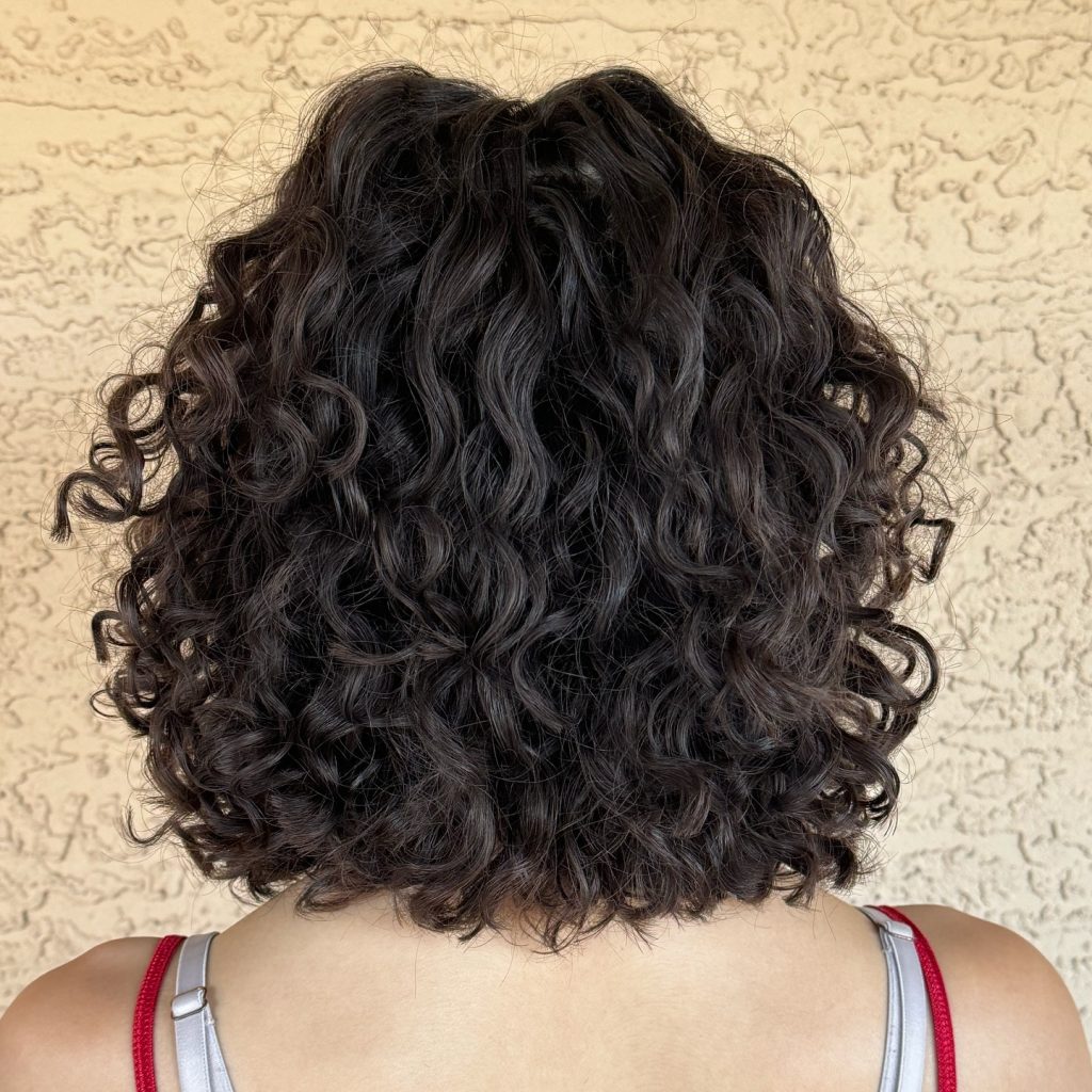 Curls Gone Wild Salon is the top curly hair salon in Gilbert. Led by Melanie brown, a dedicated stylist with a emphasis on education. Offering clients the best curly hair cuts in Gilbert and also teaching clients about maintaining their hair. Gilbert hair salon, Gilbert curly hair cuts, hair salon for curly hair Gilbert, curly hair cut in Gilbert, Gilbert curly hair triangle shape curls, curly hair layers, Gilbert AZ salon